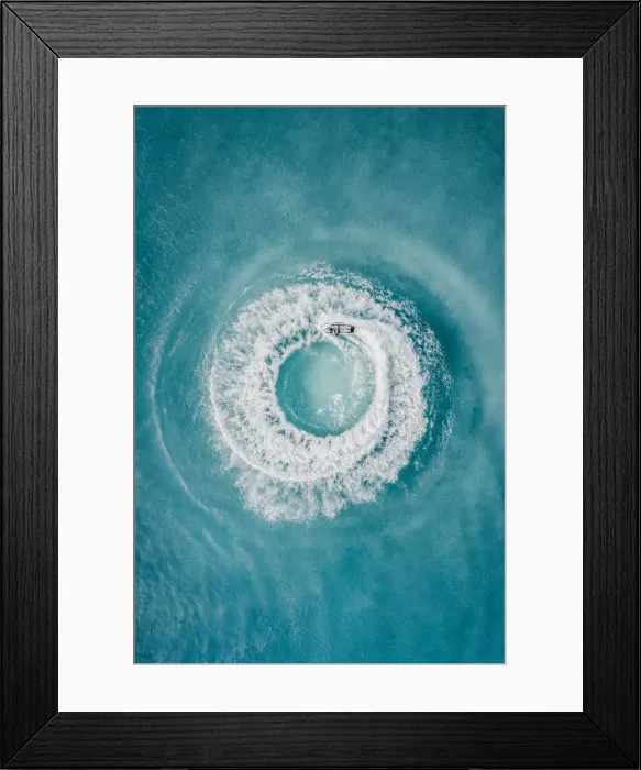 Framed Print : Circle patterns created by jet ski at sea as seen from directly above, Barbados