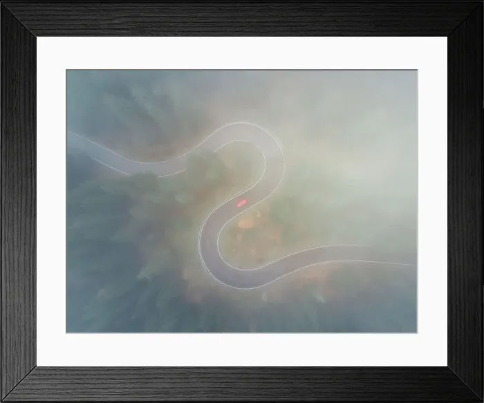 Framed Print : Drone shot through low cloud above a winding forest road, Dolomites, Italy Framed Print : Drone shot through low cloud above a winding forest road, Dolomites, Italy
