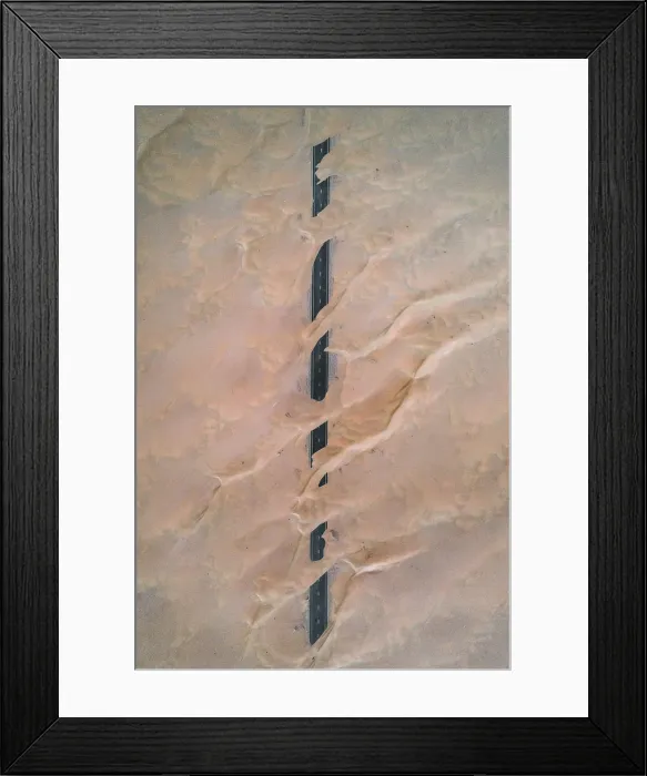 Framed Print : Dunes crossing a straight road in the desert, Dubai, United Arab Emirates