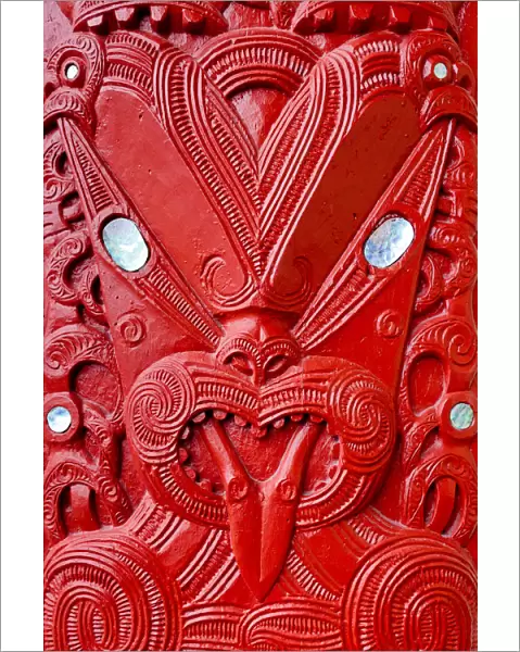 Maori tekoteko carving with paua shell decoration