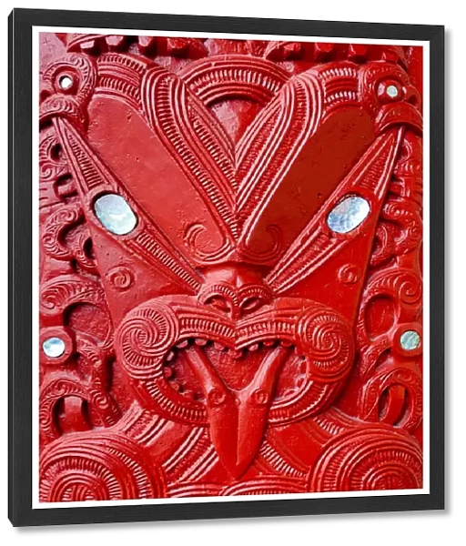Maori tekoteko carving with paua shell decoration