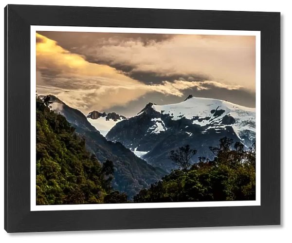 The sun setting over the Franz Josef glacier located on the south island of New Zealand