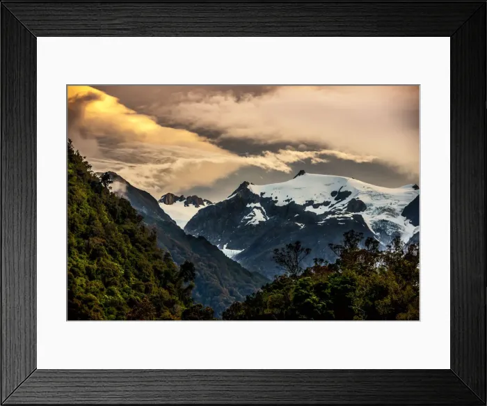 Framed Print : The sun setting over the Franz Josef glacier located on the south island of New Zealand