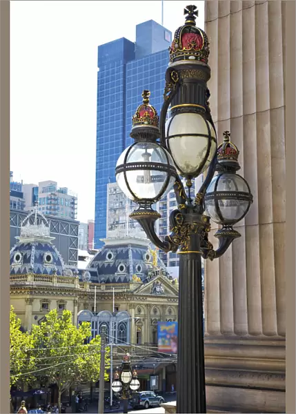 Capitols. Historic three-tiered lamp post on the steps of Parliament House