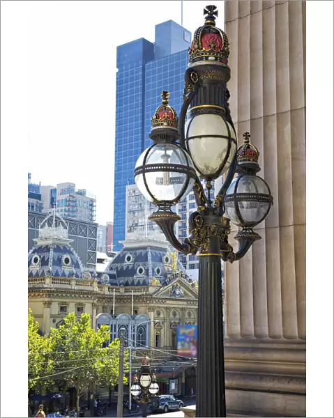 Capitols. Historic three-tiered lamp post on the steps of Parliament House
