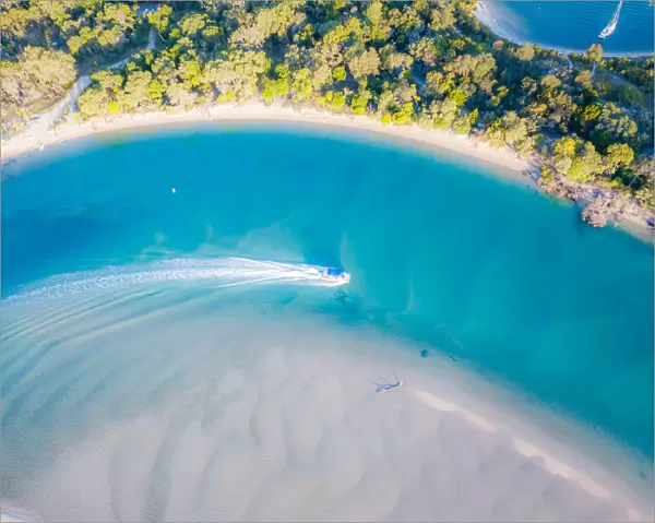 Aerial View of Noosa River with boat passing through