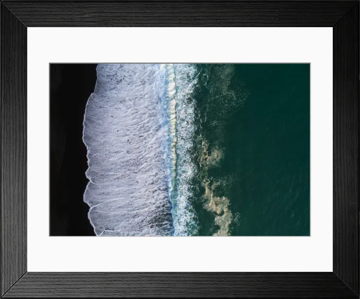 Framed Print : Looking down at black sand beach