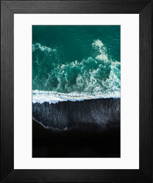 Framed Print : Looking down at black sand beach