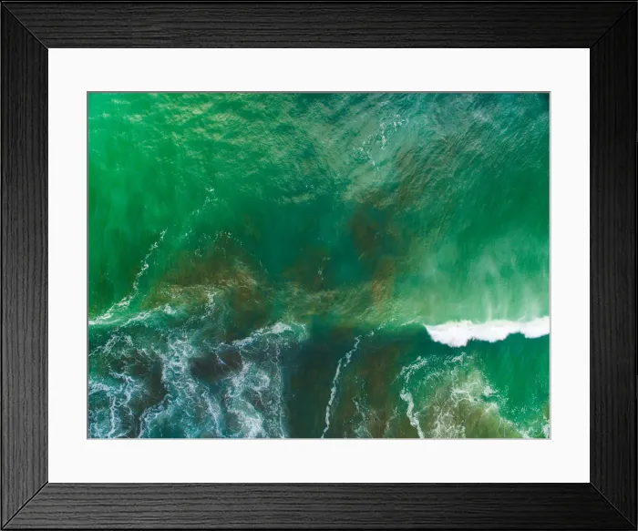 Framed Print : Top looking down at sea waves splashing at Muriwai Beach, Auckland Framed Print : Top looking down at sea waves splashing at Muriwai Beach, Auckland
