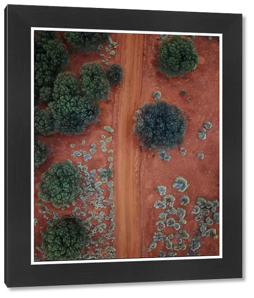 An Aerial shot of the red centre roads in the Australian Outback