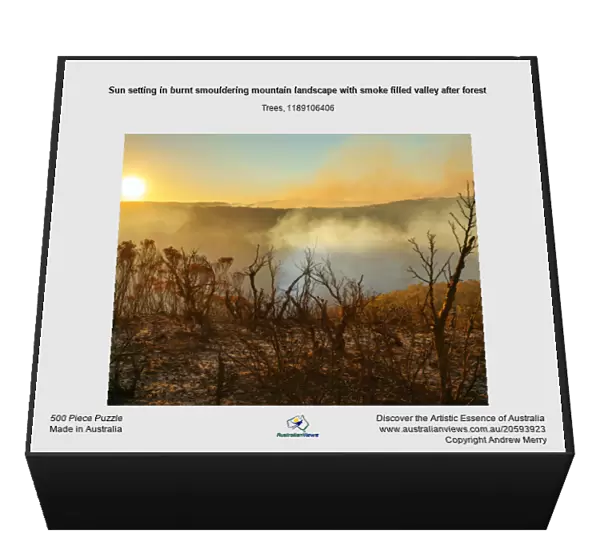 Sun setting in burnt smouldering mountain landscape with smoke filled valley after forest