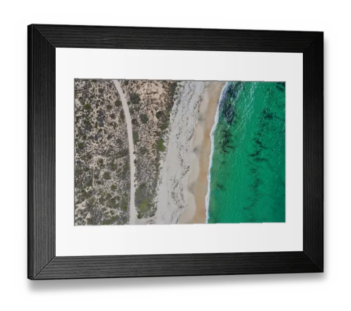 Framed Print : Dirt road to a nice sandy beach - Aerial view