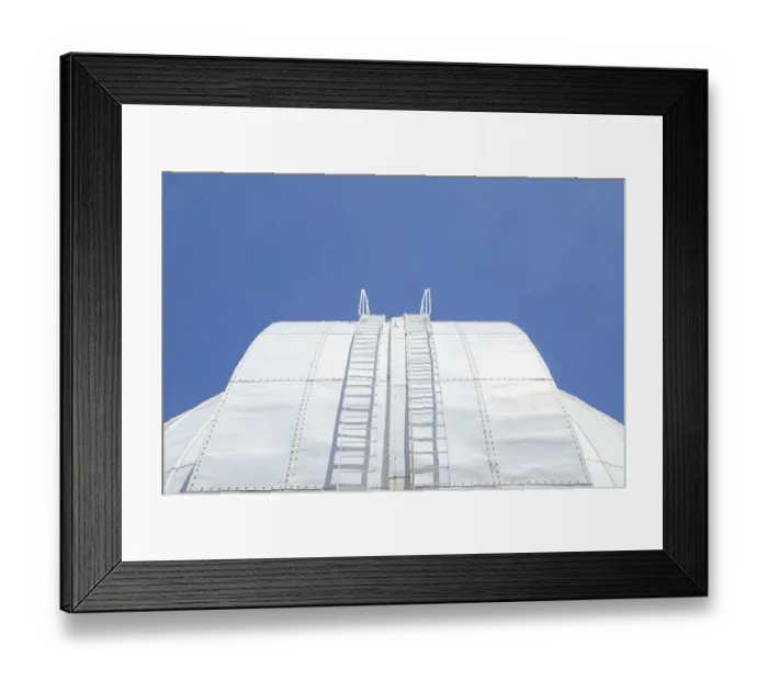 Framed Print : White round roof of a old building structure with stairs up to the top against a clear Framed Print : White round roof of a old building structure with stairs up to the top against a clear