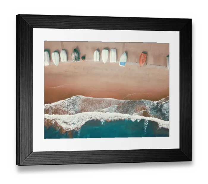 Framed Print : High angle view of small boats lined up on a sandy beach