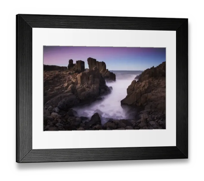 Framed Print : Motion blurred dreamy waves breaking on dramatic coastal basalt columns rock formations Framed Print : Motion blurred dreamy waves breaking on dramatic coastal basalt columns rock formations