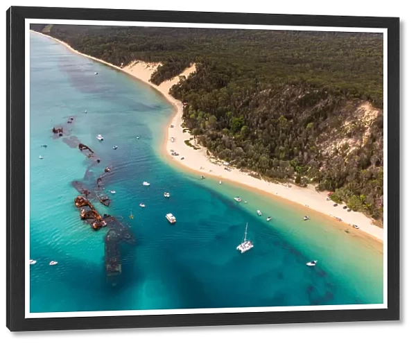 Aerial view of Moreton Island where sea meets forest