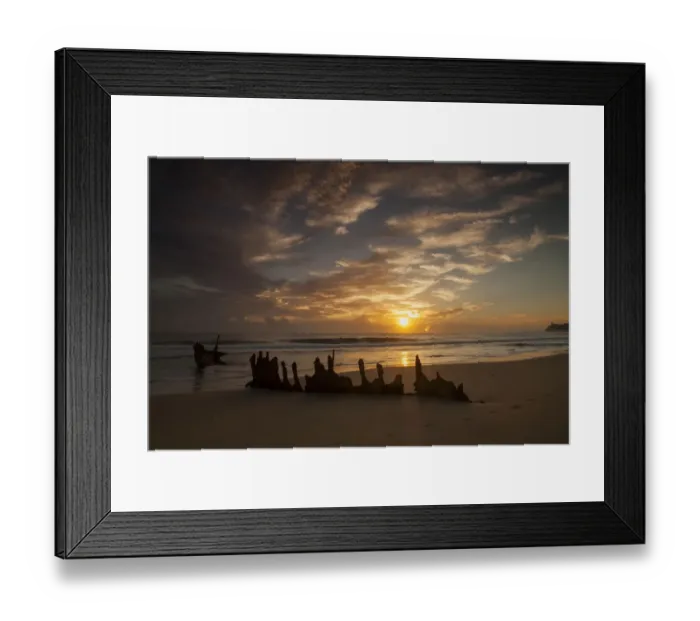 Framed Print : A dramatic sunrise on Dicky Beach with the wreck of the SS Dicky in the foreground Framed Print : A dramatic sunrise on Dicky Beach with the wreck of the SS Dicky in the foreground
