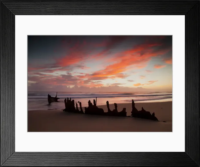 Framed Print : A dramatic sunrise on Dicky Beach with the wreck of the SS Dicky in the foreground Framed Print : A dramatic sunrise on Dicky Beach with the wreck of the SS Dicky in the foreground