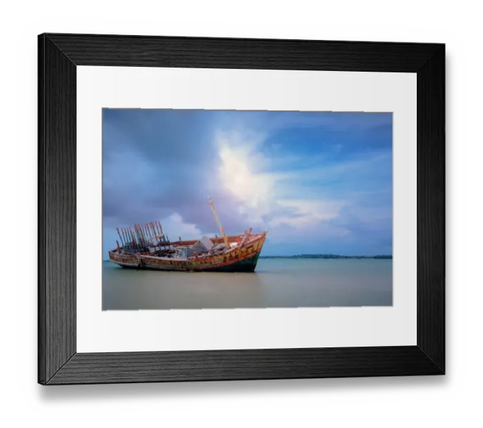 Framed Print : Old shipwreck boat abandoned stand on beach with blue sky Framed Print : Old shipwreck boat abandoned stand on beach with blue sky