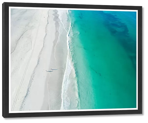 Aerial drone view of white sandy beach