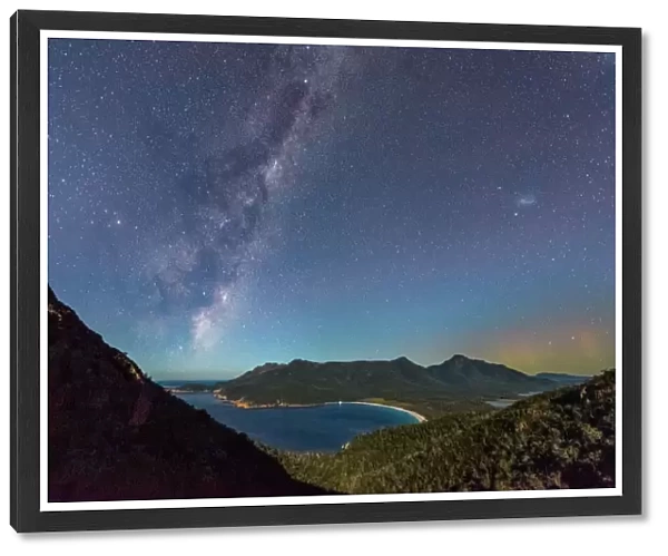 Milky Way and Aurora over a moonlit Wineglass Bay