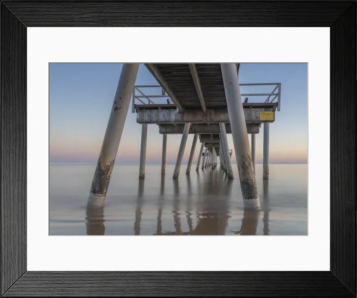 Framed Print : Water flowing under a jetty at Sunrise in Hervey Bay Framed Print : Water flowing under a jetty at Sunrise in Hervey Bay
