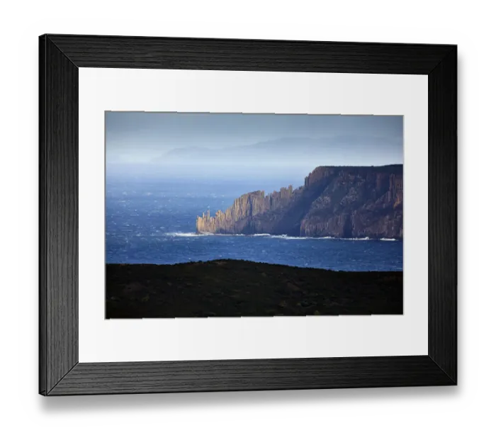 Framed Print : Blue seascape with sun illuminated rocky headland, Cape Raoul, Tasmania, Australia Framed Print : Blue seascape with sun illuminated rocky headland, Cape Raoul, Tasmania, Australia