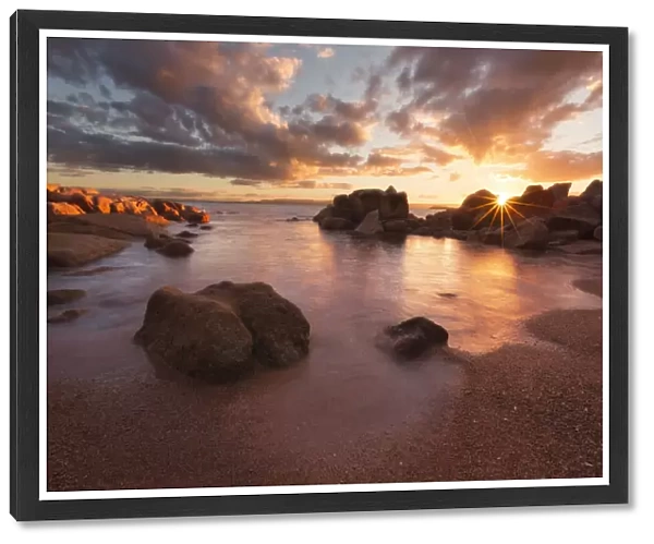 Sunset over a secluded beach in Coles Bay, Freycinet national Park, Tasmania, Australia