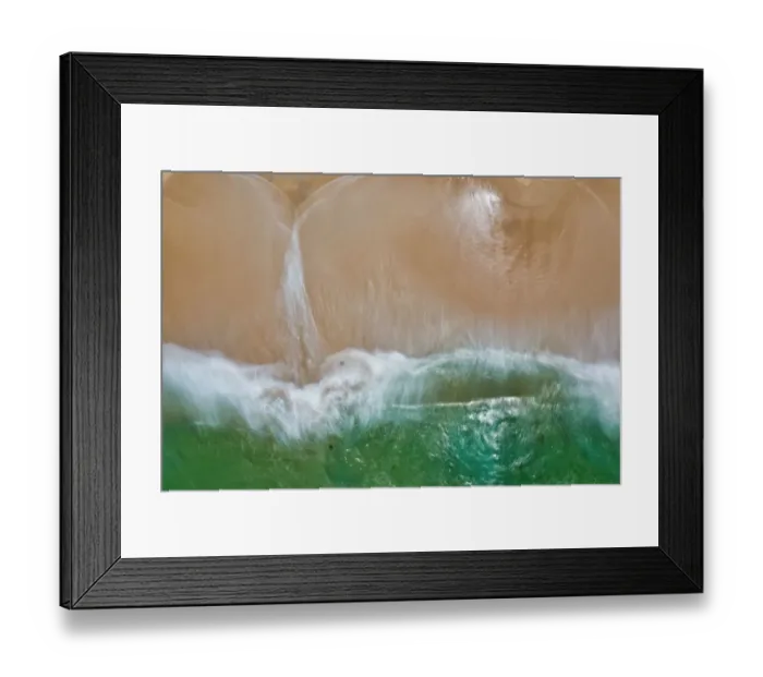 Framed Print : Aerial view of turquoise water crashing onto a sandy beach - Long Exposure