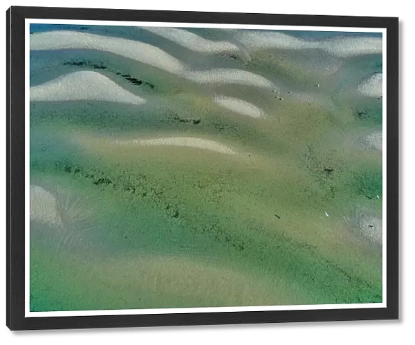 Aerial view of some sandbars forming as the tide goes out