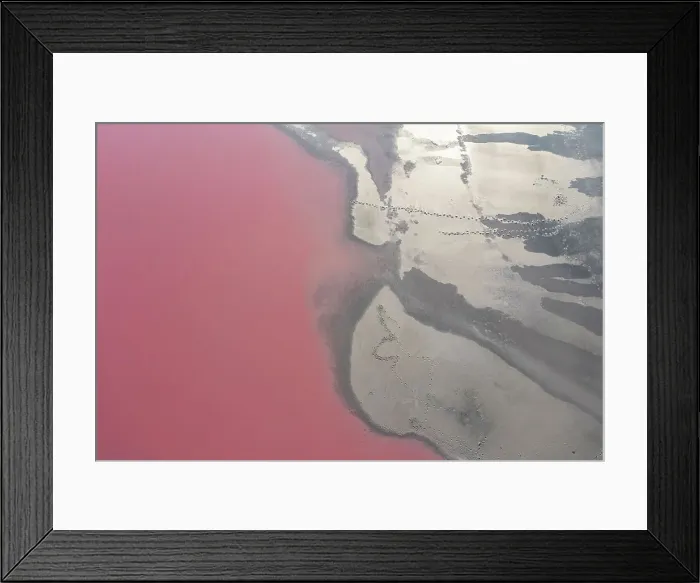 Framed Print : Drone view point of the pink shades of color, patterns and textures over Pink Lake waters with dark salty sandy soil Framed Print : Drone view point of the pink shades of color, patterns and textures over Pink Lake waters with dark salty sandy soil