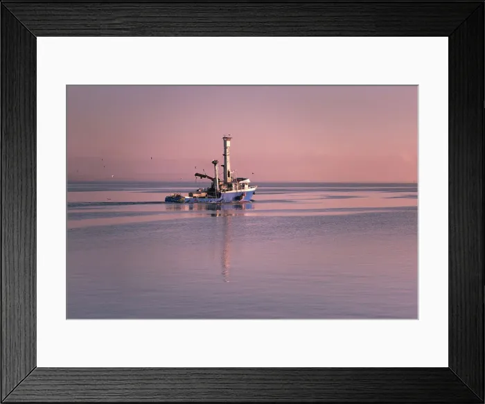 Framed Print : Fishing vessel of to work at Sunrise