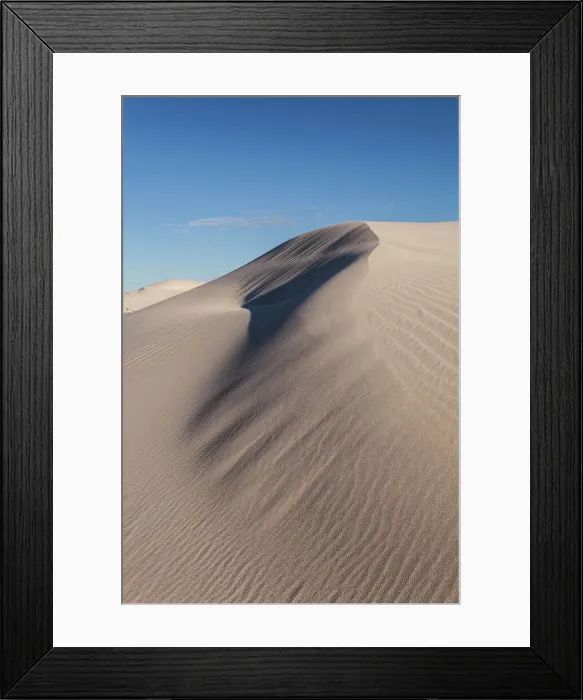 Framed Print : Sand dune with exposed textures and blue sky