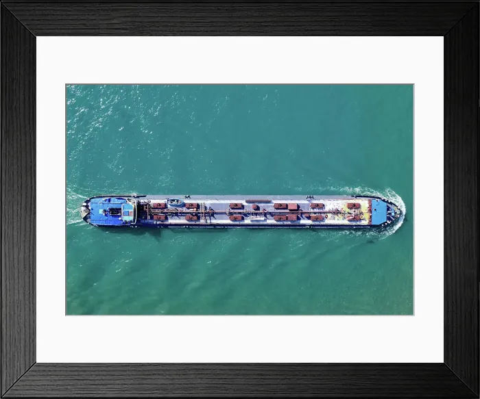 Framed Print : Aerial top view of a cargo container ship - transportation, import, export, logistics, commodity business in open sea Framed Print : Aerial top view of a cargo container ship - transportation, import, export, logistics, commodity business in open sea