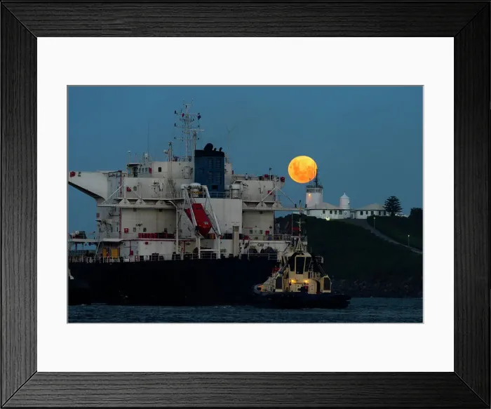 Framed Print : full moon rising above a lighthouse with ship in foreground