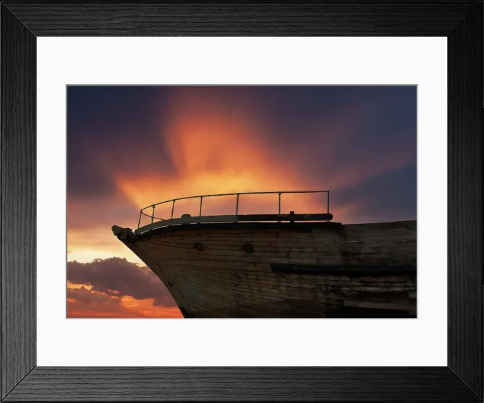 Framed Print : Ship Ahoy. Composite image of a dramatic fiery sky at dusk against part