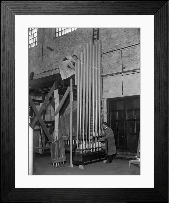 Framed Print : Adjusting The Pipes