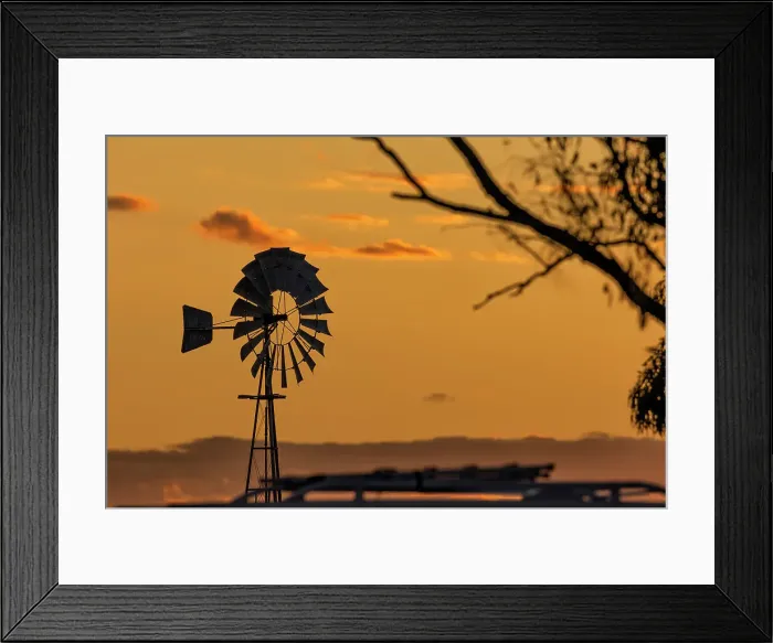 Framed Print : Windmill out in the country at sunset