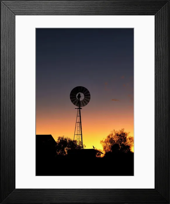 Framed Print : Windmill out in the country at sunset