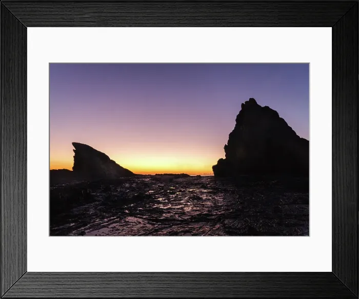 Framed Print : Pre dawn light silhouetting the rocks at Currumbin at the Gold Coast. The first light is reflecting on the water on the foreground rocks