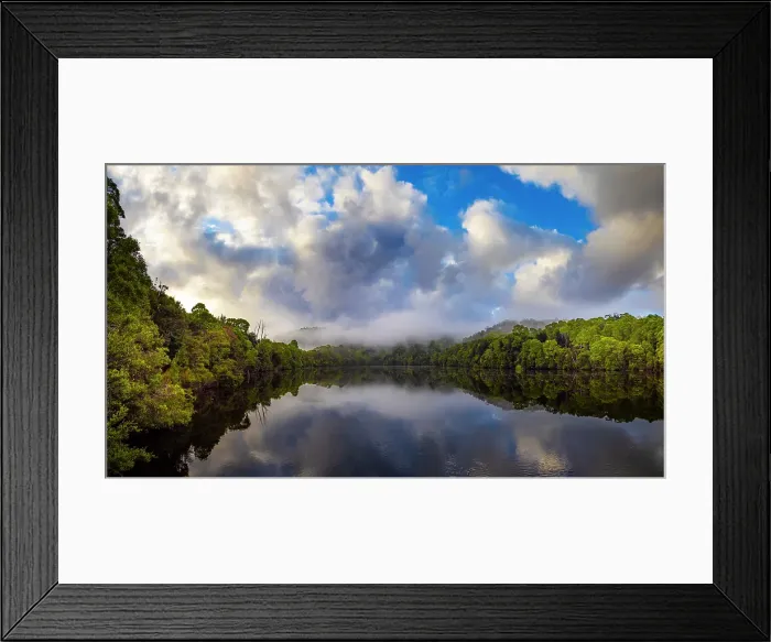 Framed Print : Reflected light over the Pieman river in the Tarkine wilderness area on the west coast of Tasmania Framed Print : Reflected light over the Pieman river in the Tarkine wilderness area on the west coast of Tasmania
