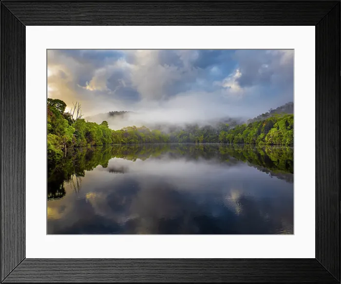 Framed Print : Reflected light over the Pieman river in the Tarkine wilderness area on the west coast of Tasmania Framed Print : Reflected light over the Pieman river in the Tarkine wilderness area on the west coast of Tasmania