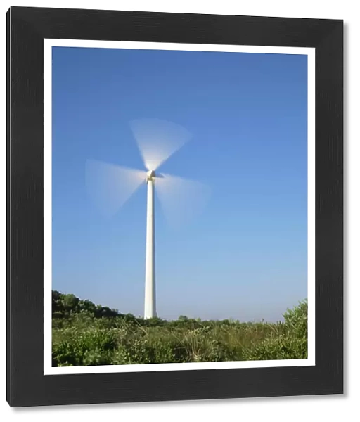 Wind turbine in rural landscape