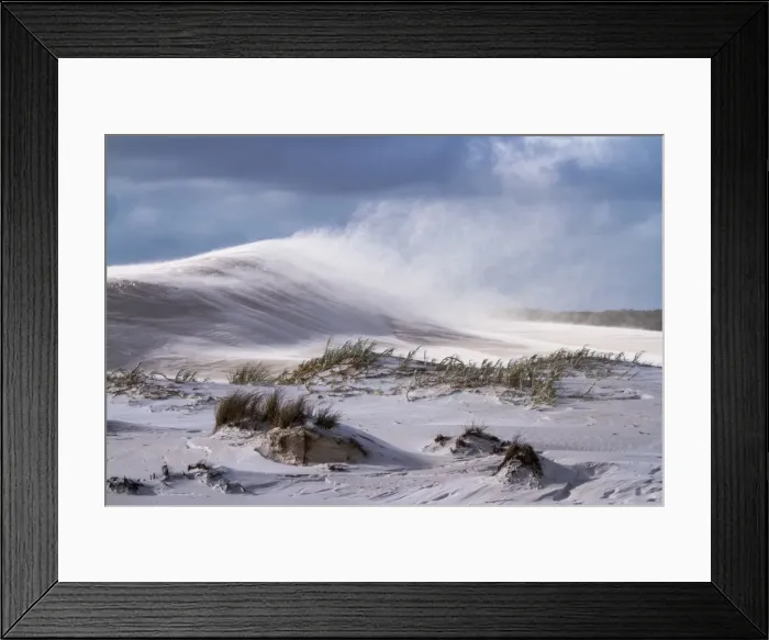 Framed Print : Dunes. Wind blowing the sand and causing sand drift off the beautiful textured dunes
