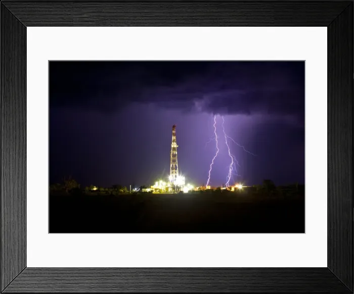 Framed Print : Drilling under thunderstorm