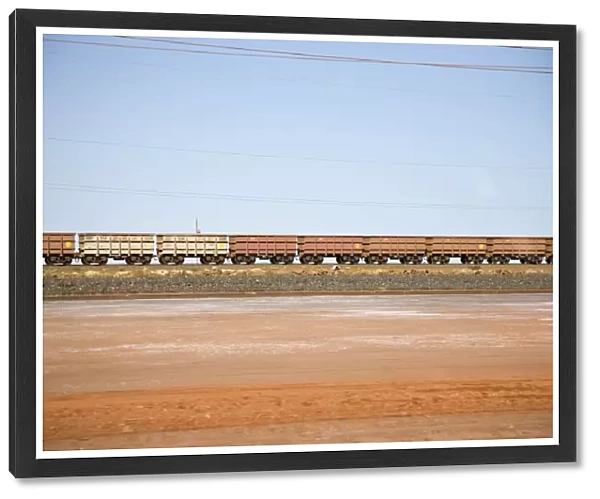 Freight train moving through a desert landscape, Port Hedland, Western Australia, Australia