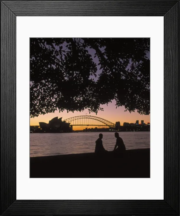 Framed Print : Australia, New South Wales, Sydney, silhouette of couple with Harbour Bridge and Opera house in background at sunset