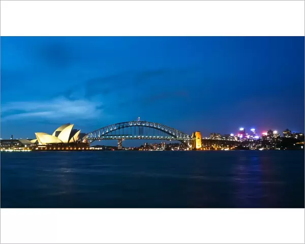 Sydney Harbour Bridge & Opera illuminated at dusk