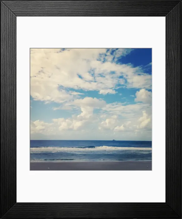 Framed Print : Small island on the horizon of the ocean