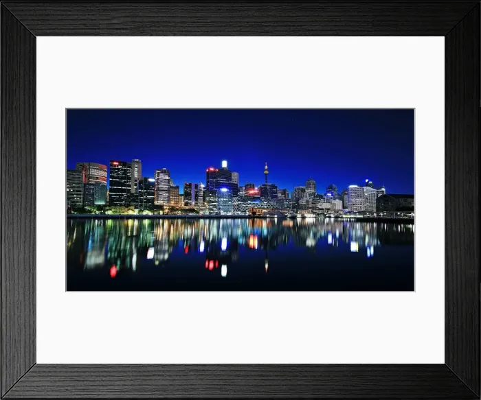 Framed Print : Skyline. View of Sydney skyline reflecting in water at night, Australia